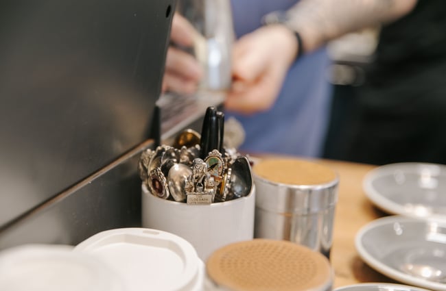 Close up of teaspoons in a jar at Dispense Espresso in Christchurch.