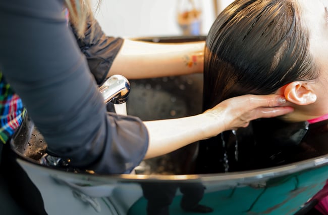 Miki washing a customer's hair at Doki Hair Salon.