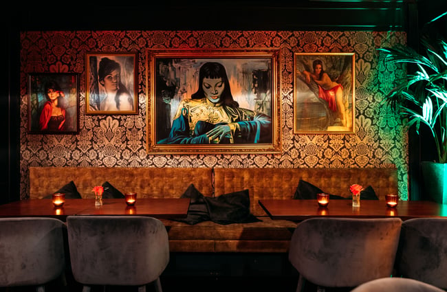 Bench seating inside a dimly lit bar.