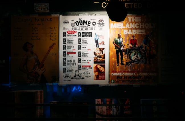 A close up of a poster on a wall.