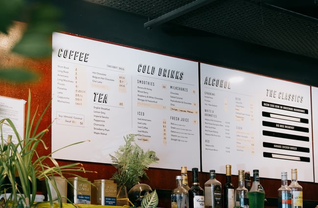 Menu board above counter at Dose Diner in Christchurch