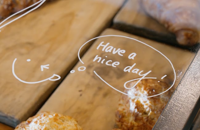 Have a nice day message on cabinet glass at Dose Diner in Christchurch