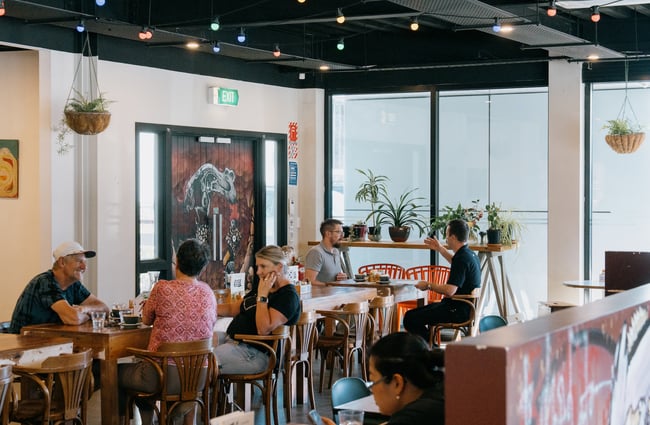 People having coffee inside at Dose Diner in Christchurch