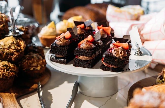 Close up of chocolate loaf cakes in cabinet of bakery