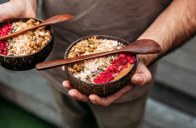A person holds two smoothie bowls at Dripping Bowl, Wānaka.