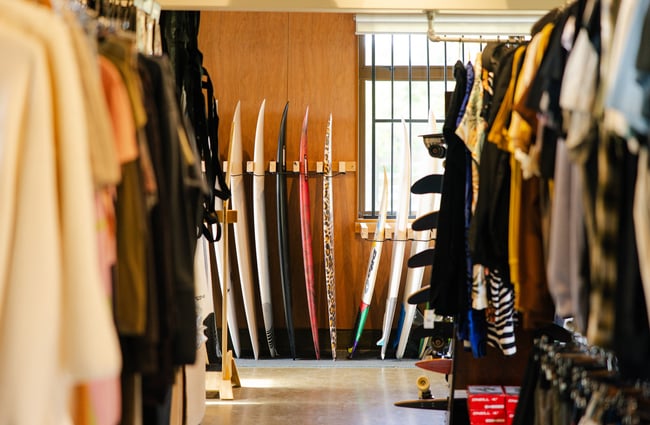 Clothing and surfboards at Drop In Surf & Supply.