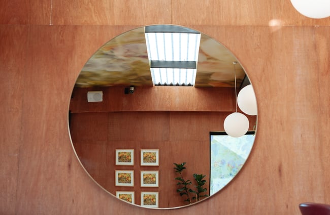 A mirror on a wall.