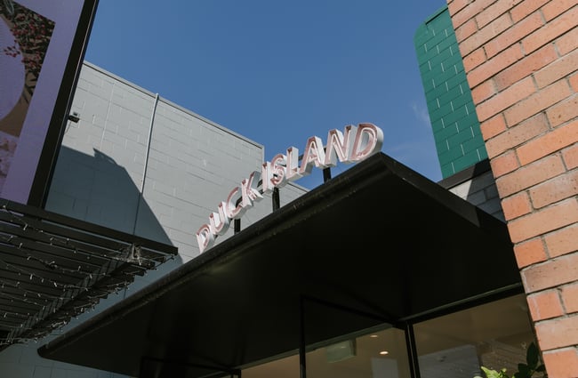 A 'Duck Island' sign on top of a roof.