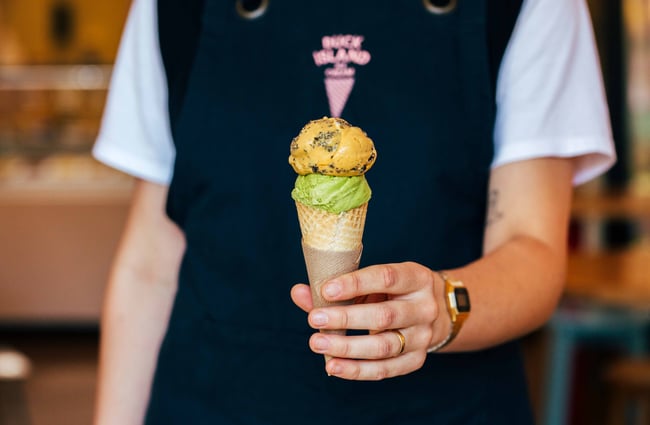 Someone holding an ice cream.