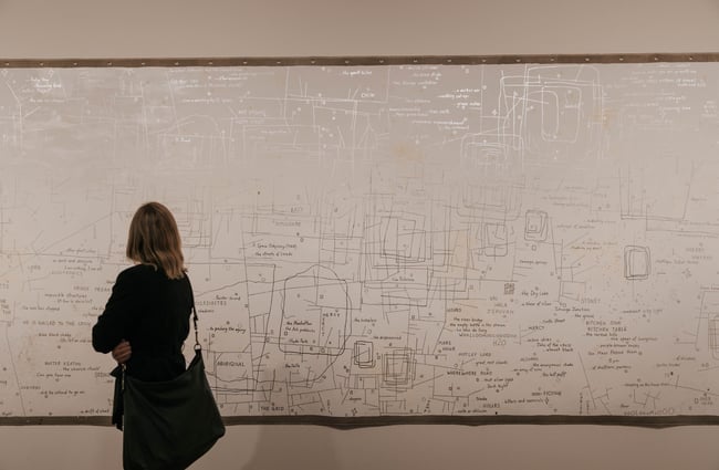 A woman looking at art.