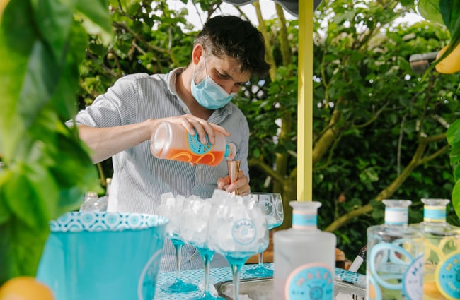 Man making a gin cocktail using cooper measure at Dux Dine, Christchurch.