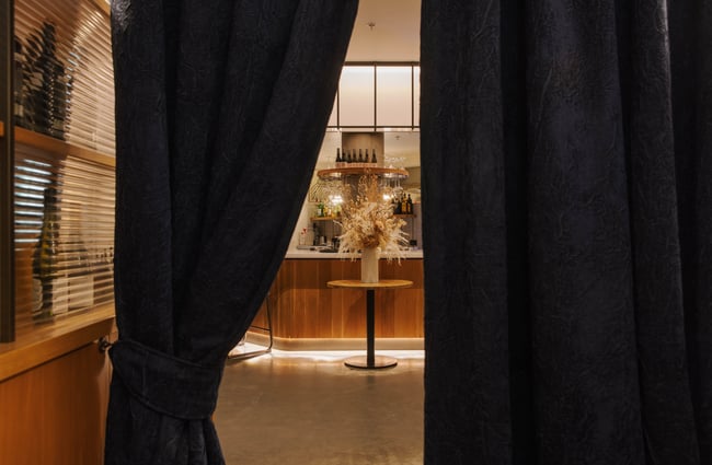 Entrance to Earl in Christchurch with deep blue velvet curtains.