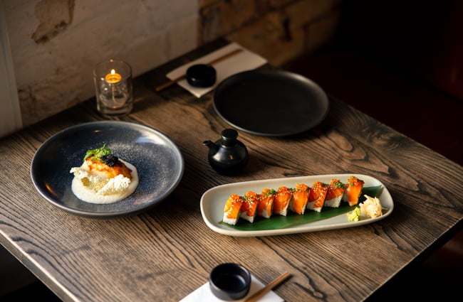 Plates of Japanese food on a table.