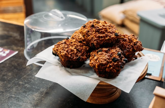 Muffins on a stand at Ebony Coffee Roasters.