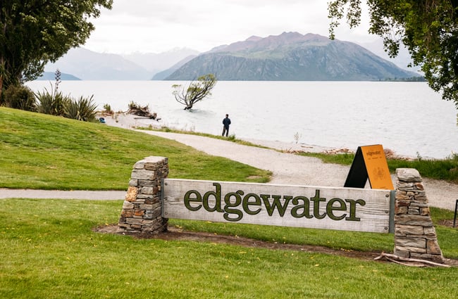 Hotel signage by the lake for Edgewater Hotel.