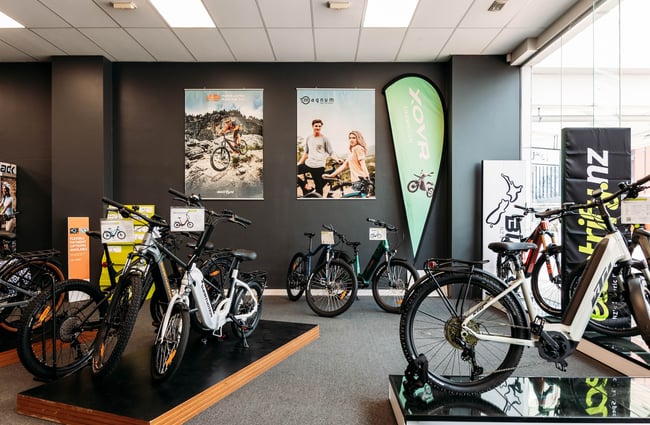 Bikes displayed inside Electrify bike store.