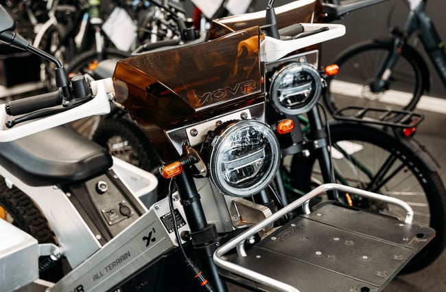 Close up of the front light of a scooter.
