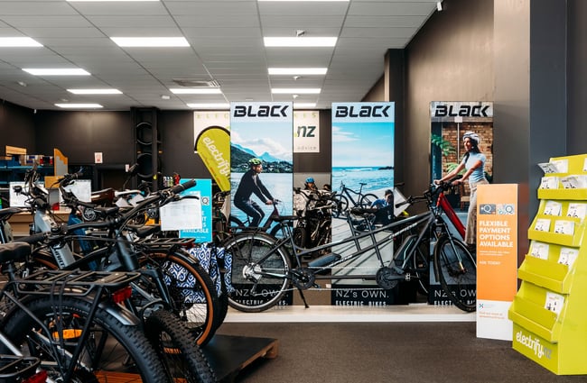 Interior view of Electrify with a tandem bike in the back.
