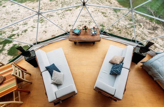 A view of couches photographed from above.