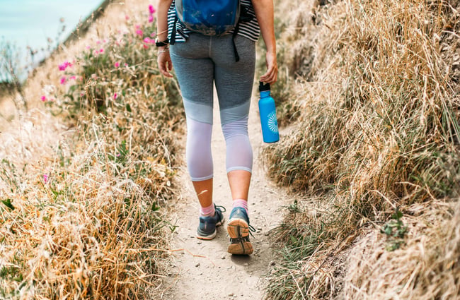 Woman's legs walking along the track.