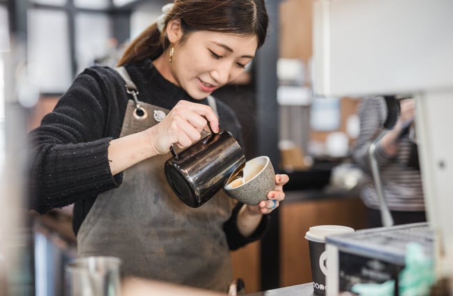 Barista making coffee at Espresso Workshop.