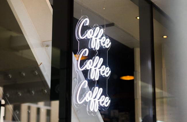 Neon sign in the window at Espresso Workshop.