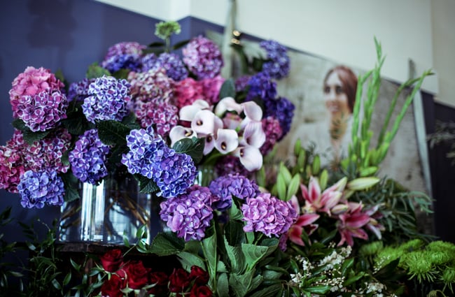 A bunch of flowers on a counter.