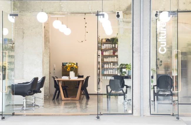 Products on display and hairdresser chairs at Fabrik, Hamilton.