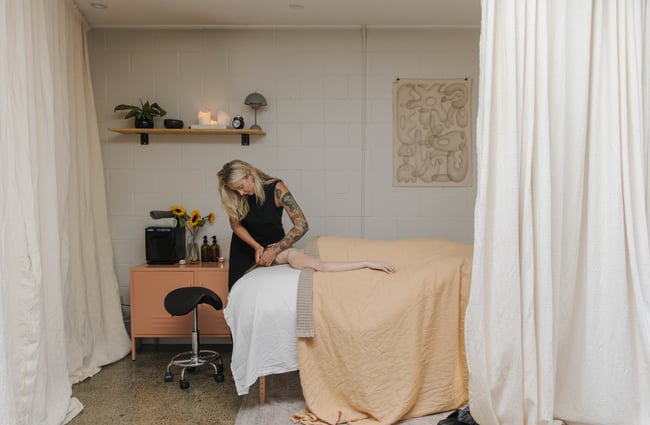 A woman receiving a facial inside Face It Christchurch.