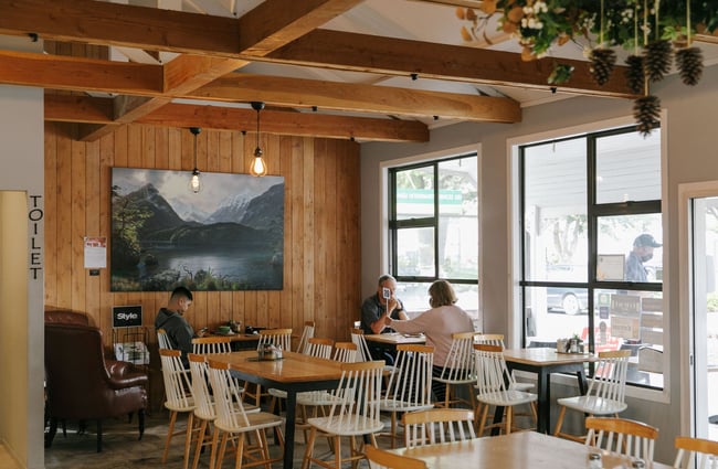Customers sitting at tables inside Fairlie Bakehouse.