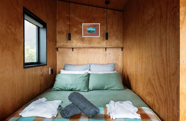 Bed in Falcon Ridge cabin.