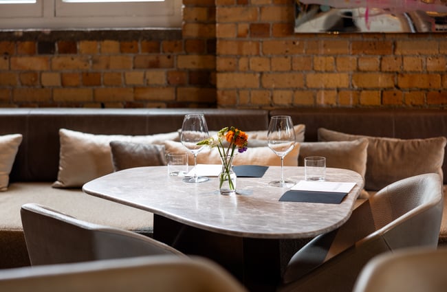Close up of stylish dining chair and set table at cafe/bar