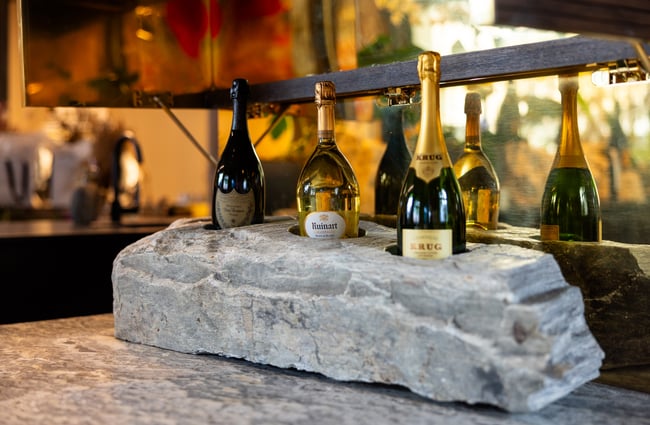 French Champagne bottles in stone holder