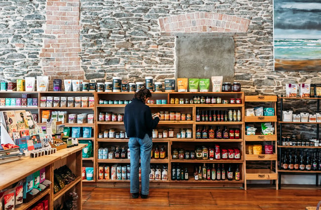 A woman browsing products at Feinerman’s General Store Roxburgh.