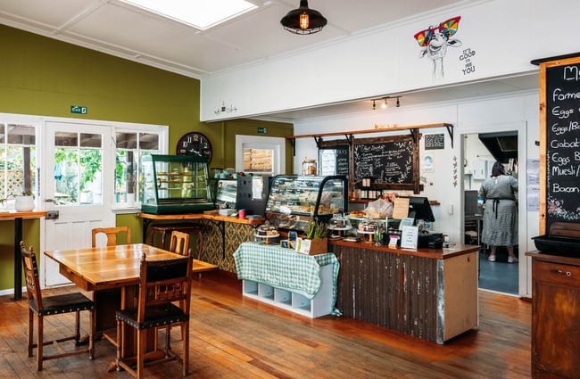 Blackboard menu and fully stocked cabinet at Feliz & Sage