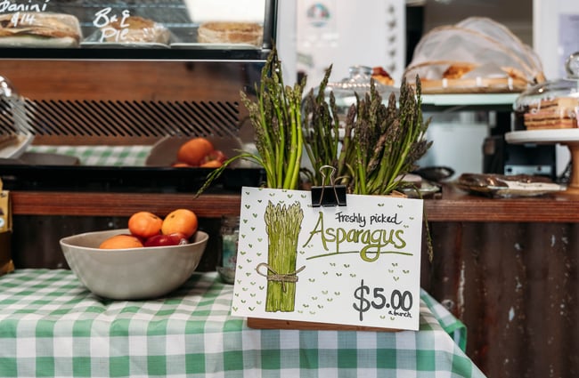 Bunches of freshly picked asparagus available at cafe counter