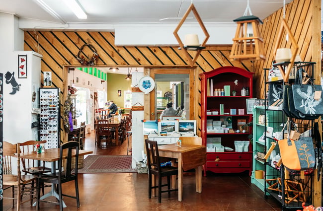 Gift shop space at Feliz & Sage with cafe tables