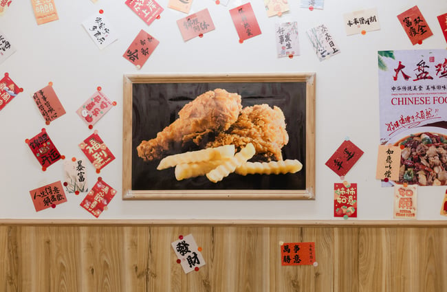 Food pictures on the wall at FJ Noodles & Dumplings.