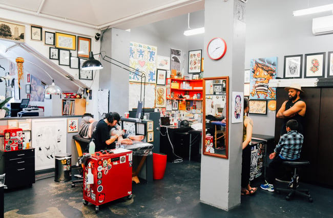 The tattoo artists at work in the studio.