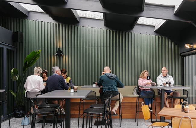 Customers sitting down at tables at Flo & Co.