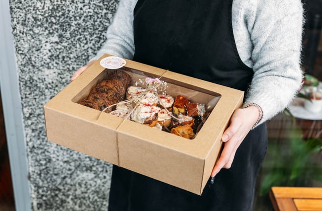 A close up of cakes in a box.