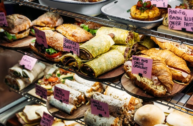 A close up of cabinet food behind glass.