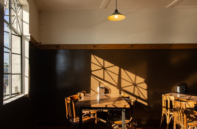 Sun shining through a cafe window.