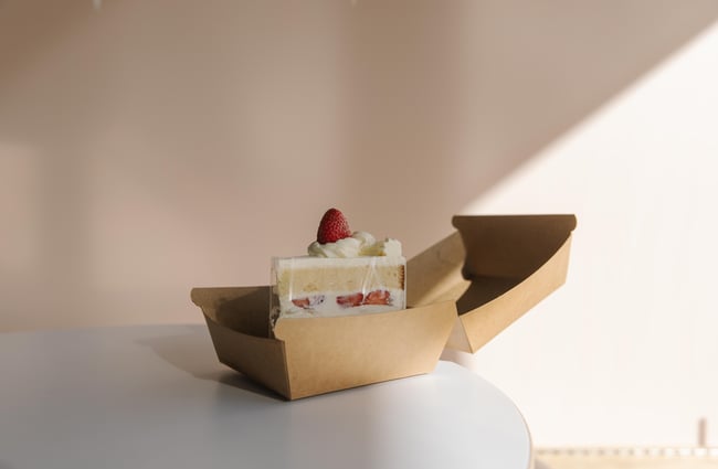 Slice of cake sitting on the table at Fluffy Bake Shop.