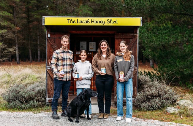 The family who run the business standing in front of the shed at Forage & Gold.