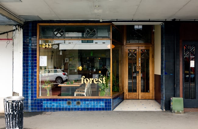 The blue and wooden exterior of Forest restaurant in Auckland.