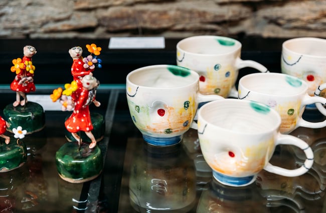 A close up of colourful mugs.