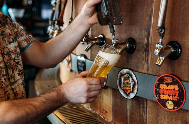 Pint being pulled at Fork & Brewer.