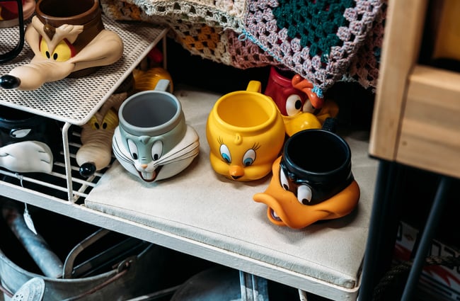 A close up of Loony Tunes mugs.