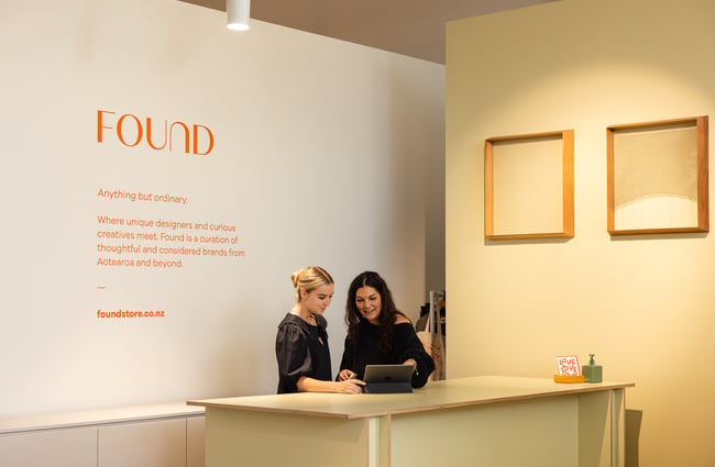 Shop assistants behind the counter at FOUND.